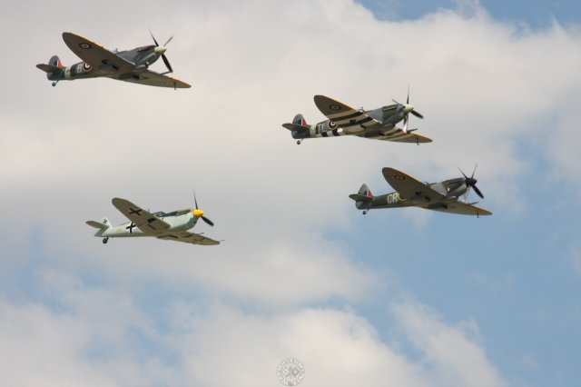 threespitfiresandoneme109duxford.jpg